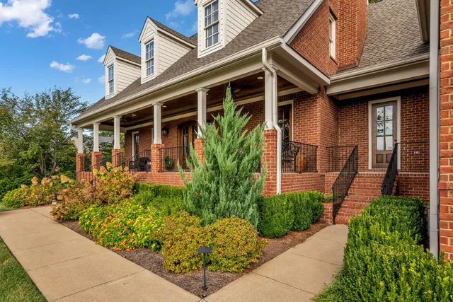a view of a swimming pool and outdoor seating