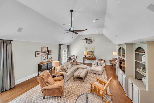 a view of a house with backyard sitting area and garden