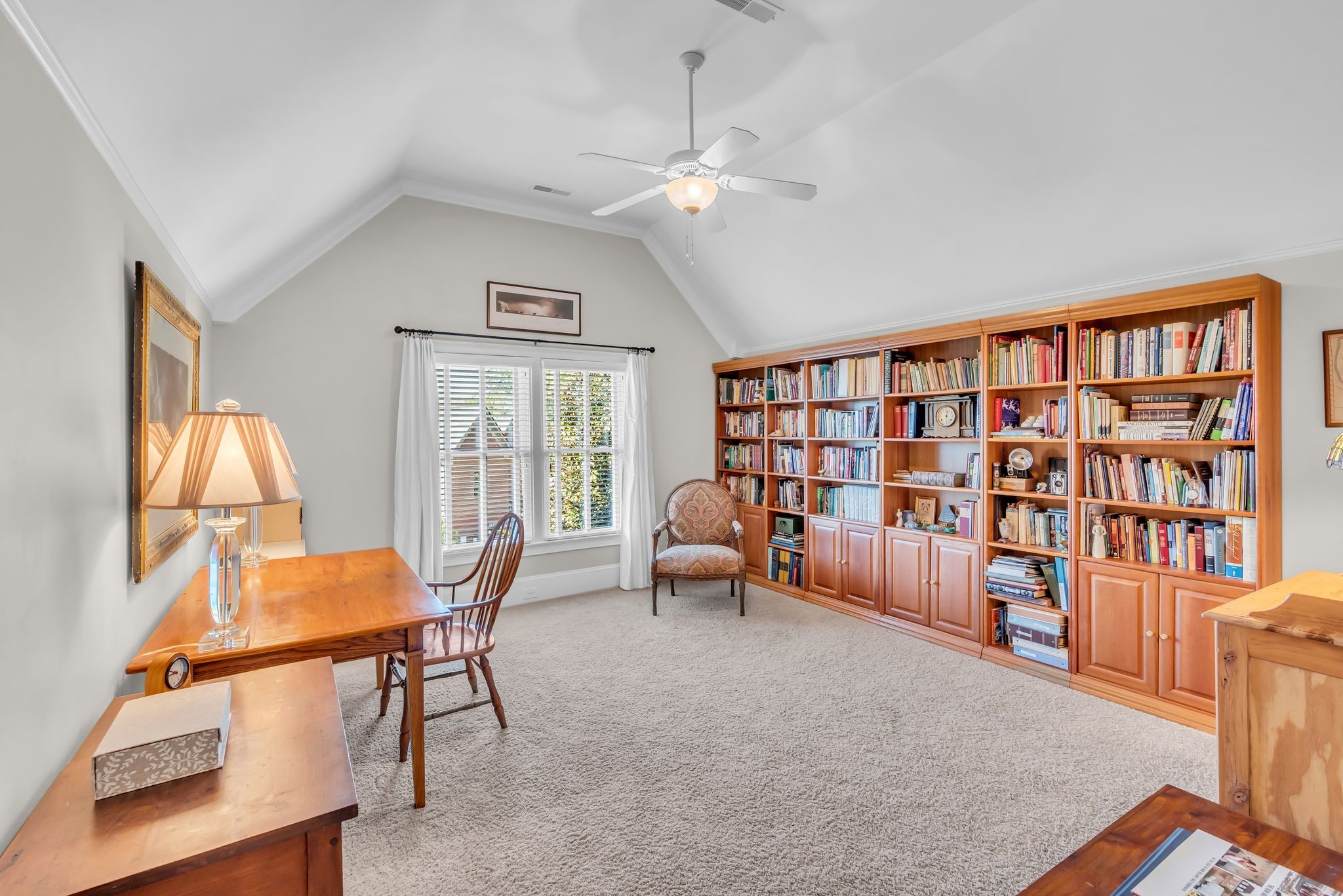 2449 Durham Manor Drive Franklin, TN 37064 - Photo 50 of 88 a living room with furniture and a book shelf