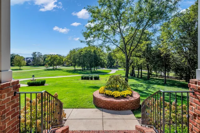 a view of an entryway with wooden floor and door