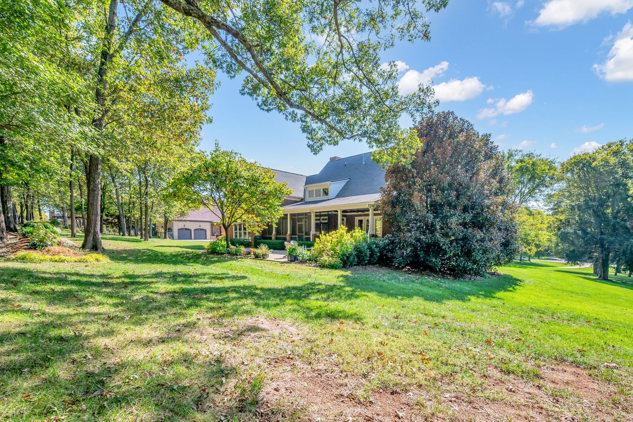 2449 Durham Manor Drive Franklin, TN 37064 - Photo 75 of 88 a view of a big yard next to a house