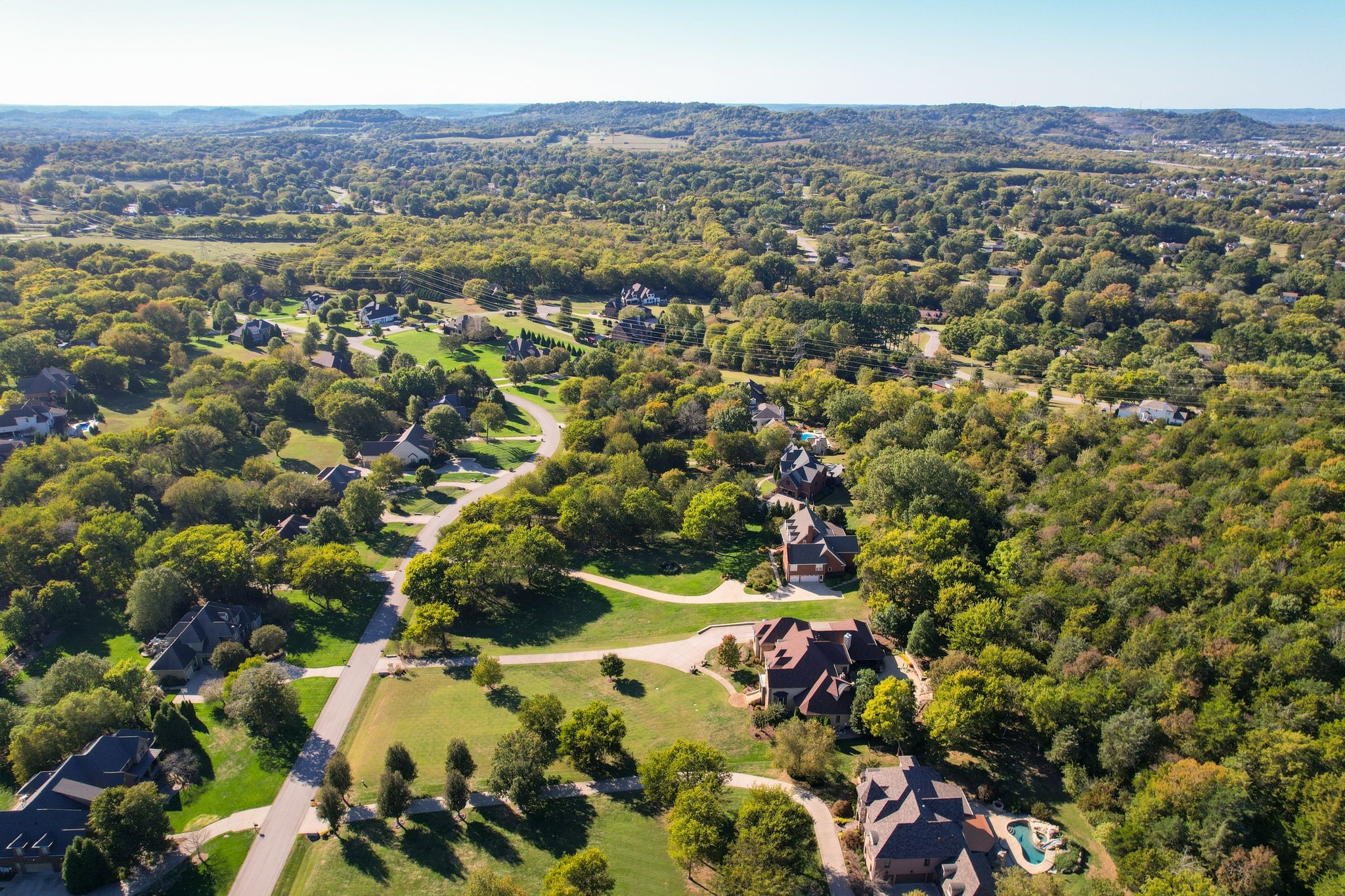 2449 Durham Manor Drive Franklin, TN 37064 - Photo 88 of 88 an aerial view of residential houses with outdoor space and trees