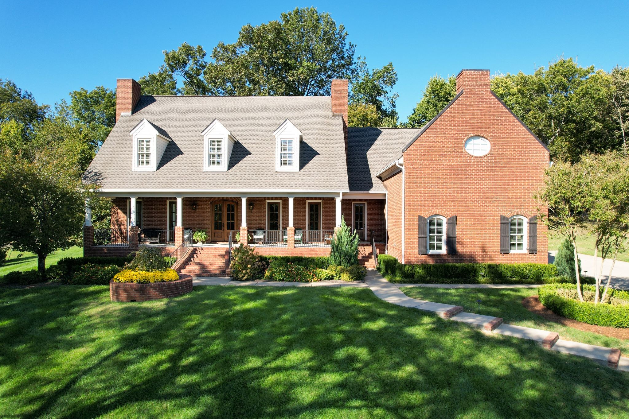 2449 Durham Manor Drive Franklin, TN 37064 - Photo 9 of 88 a view of a house with a yard