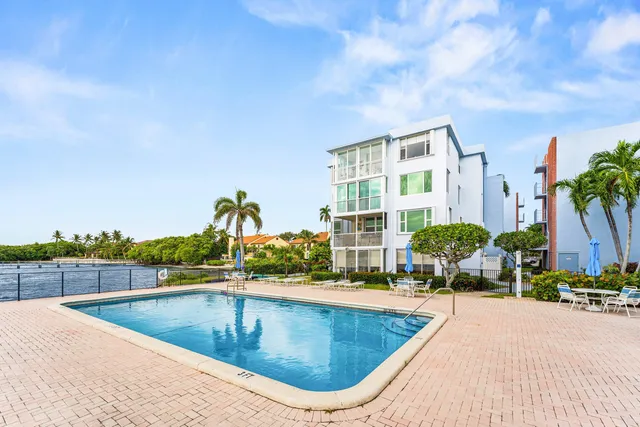 a view of swimming pool with outdoor seating