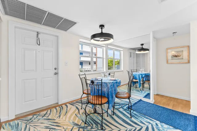 a dining room with furniture and window