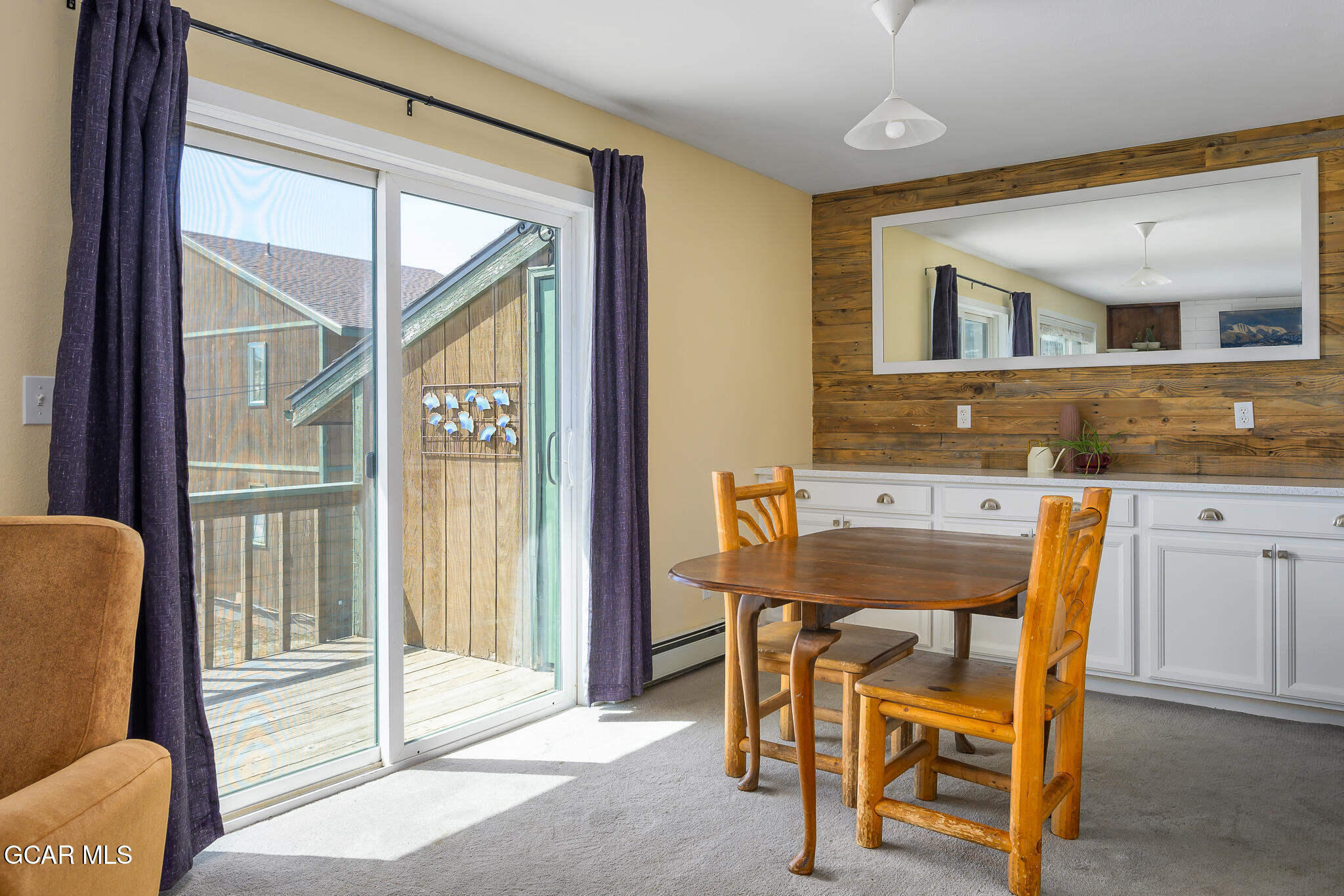 110 Carriage Road, Unit 8 Fraser, CO 80442 - Photo 11 of 36 a view of a dining room with furniture and a window