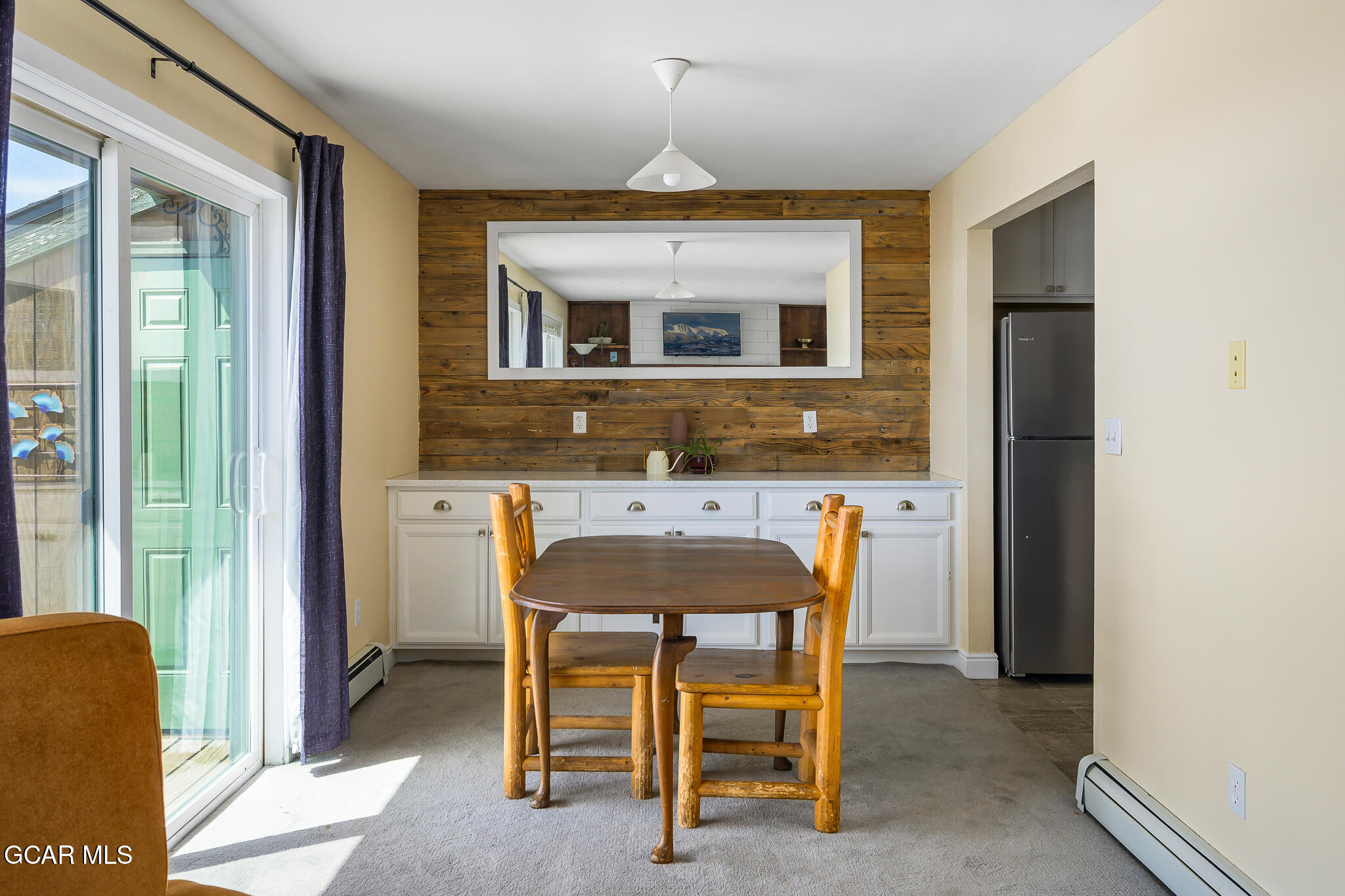 110 Carriage Road, Unit 8 Fraser, CO 80442 - Photo 12 of 36 a dining room with furniture and window