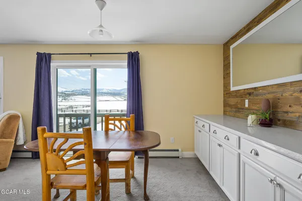 a view of a dining room with furniture window and outside view