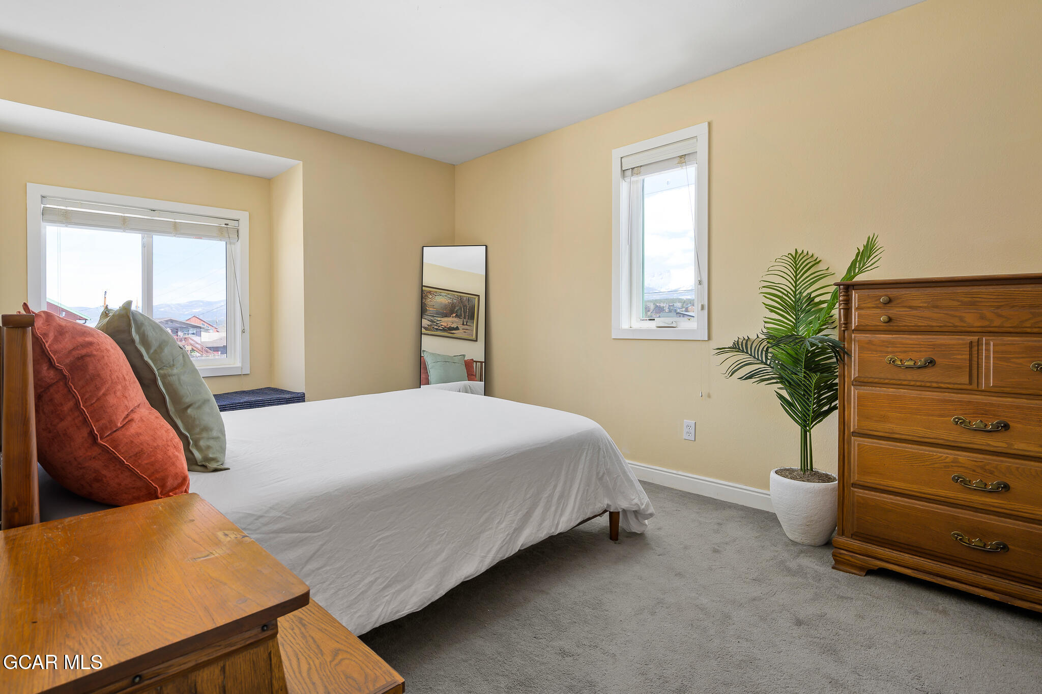 110 Carriage Road, Unit 8 Fraser, CO 80442 - Photo 18 of 36 a bedroom with a bed and a couch