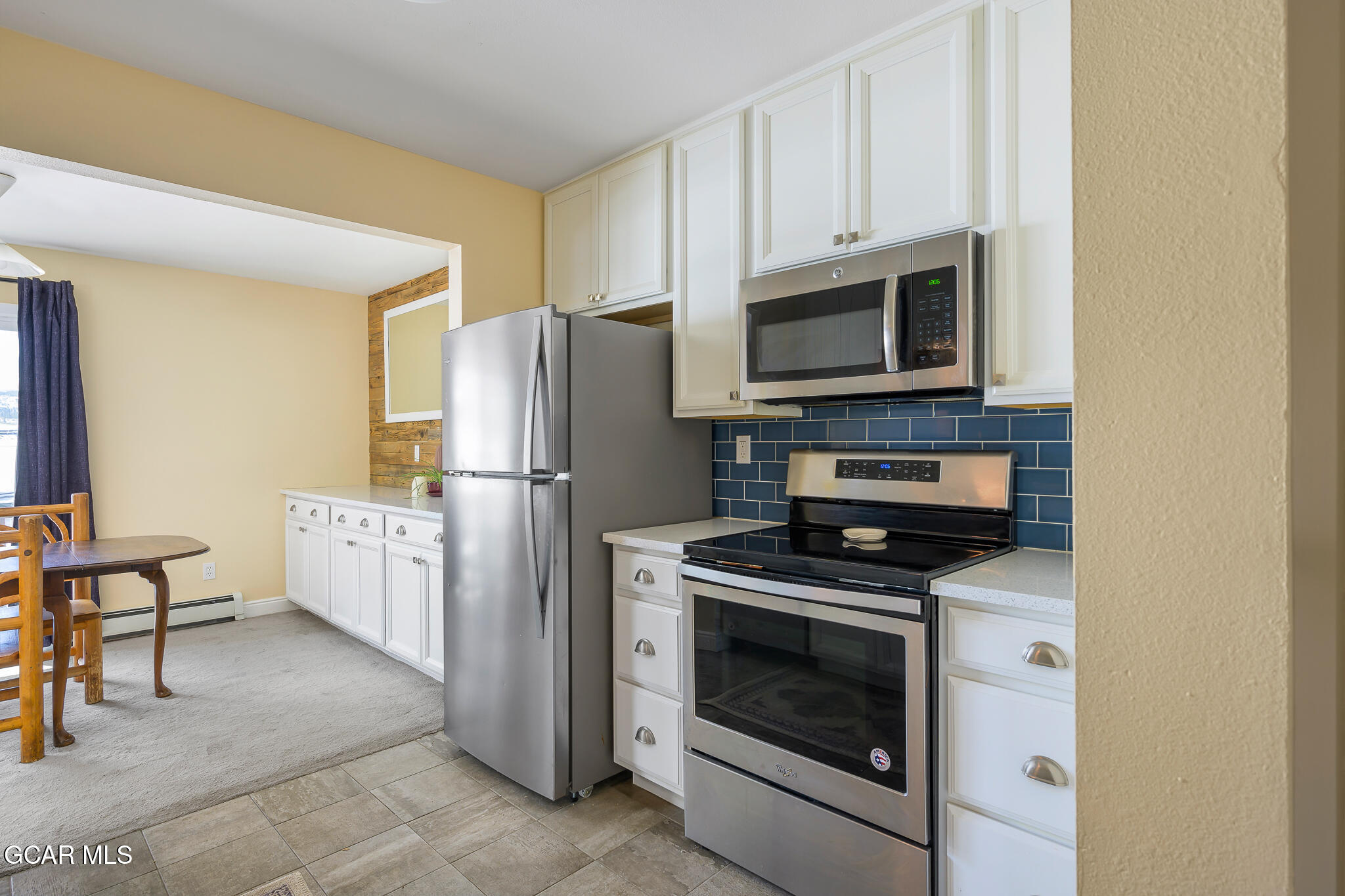 110 Carriage Road, Unit 8 Fraser, CO 80442 - Photo 2 of 36 a kitchen with a stove microwave and refrigerator