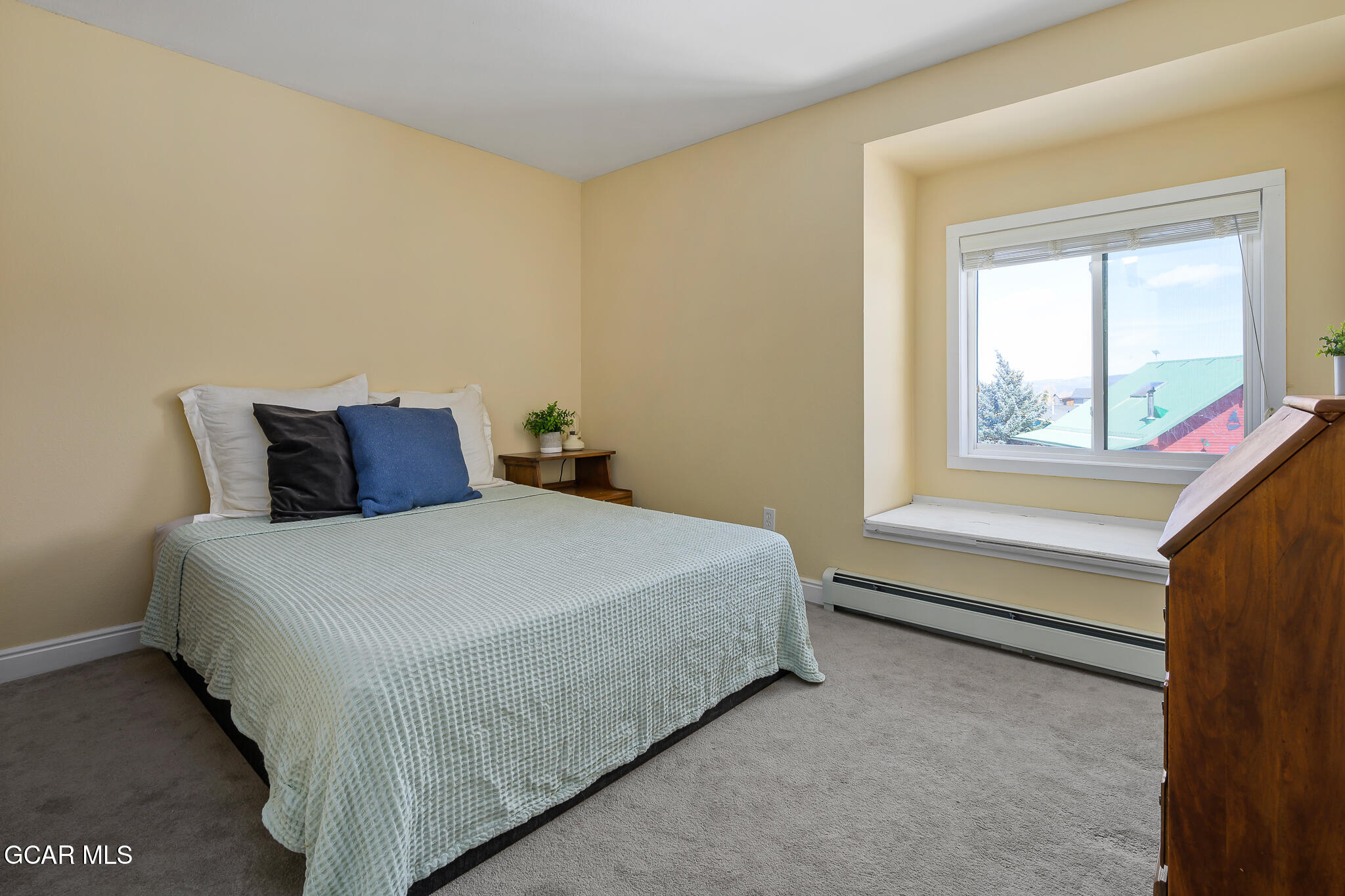 110 Carriage Road, Unit 8 Fraser, CO 80442 - Photo 23 of 36 a bedroom with a bed and window