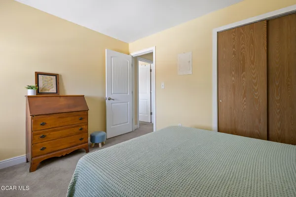 a view of a balcony with wooden floor