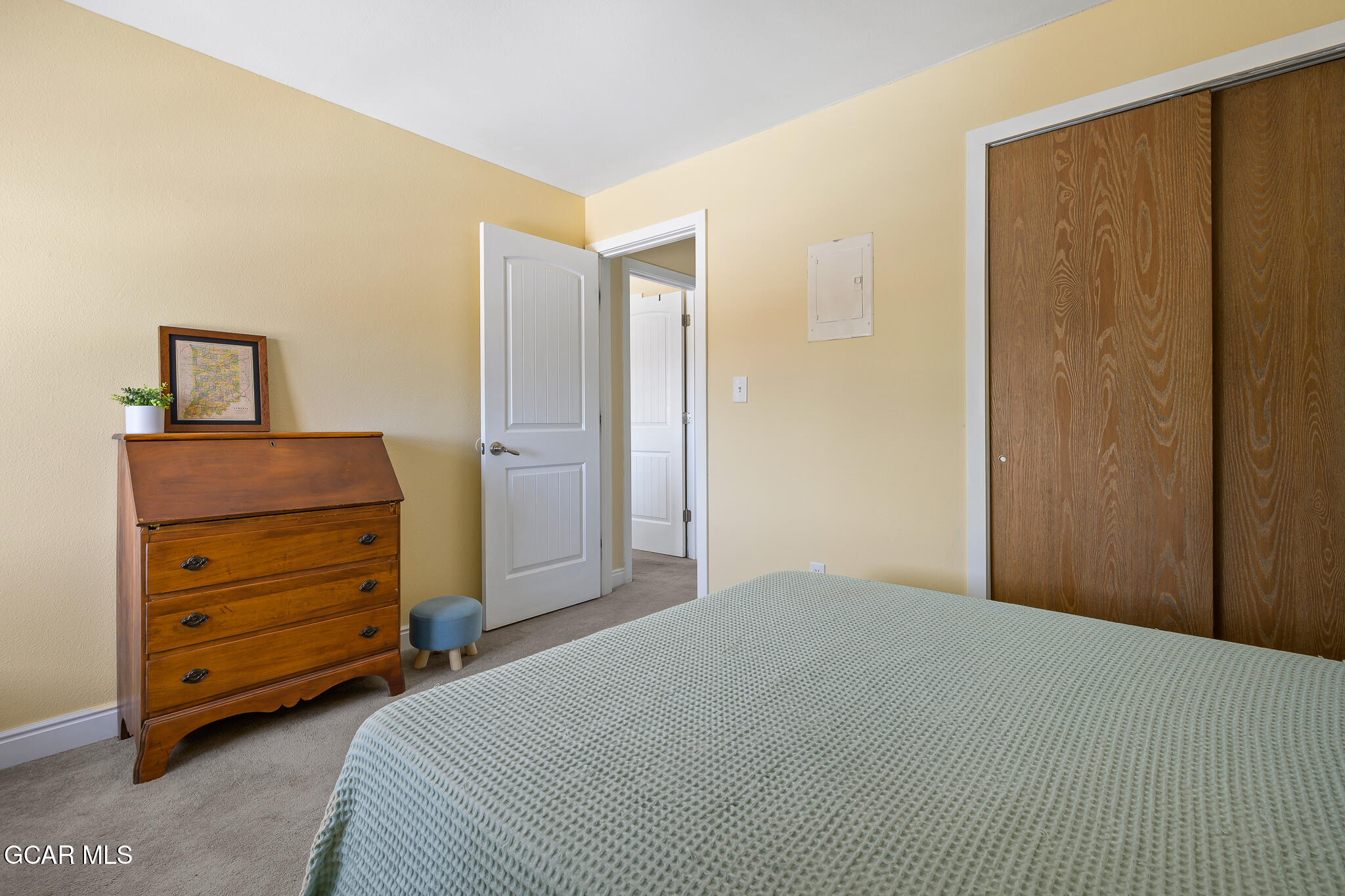 110 Carriage Road, Unit 8 Fraser, CO 80442 - Photo 24 of 36 a bedroom with a bed and a dresser