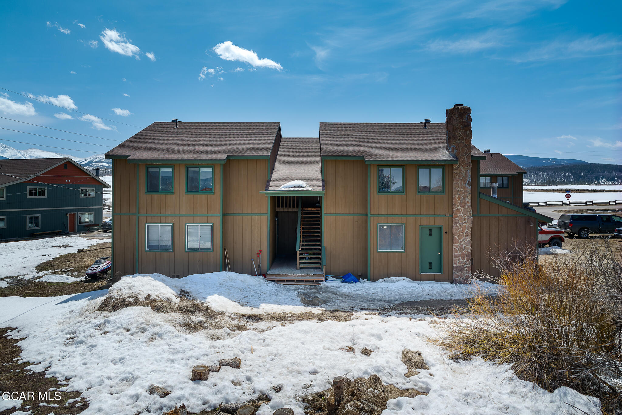 110 Carriage Road, Unit 8 Fraser, CO 80442 - Photo 32 of 36 a front view of a house with a yard