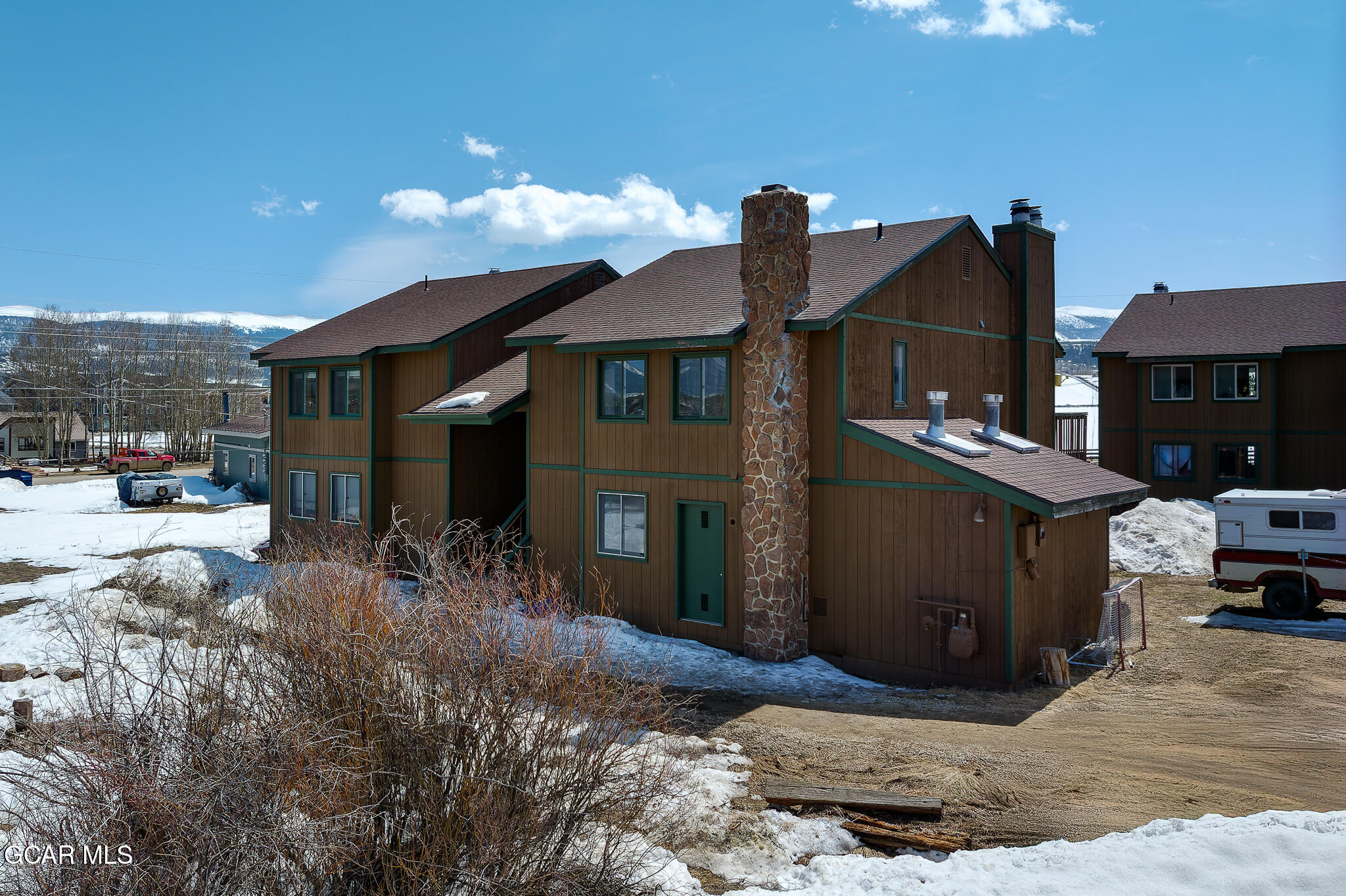 110 Carriage Road, Unit 8 Fraser, CO 80442 - Photo 33 of 36 a front view of a house with a yard