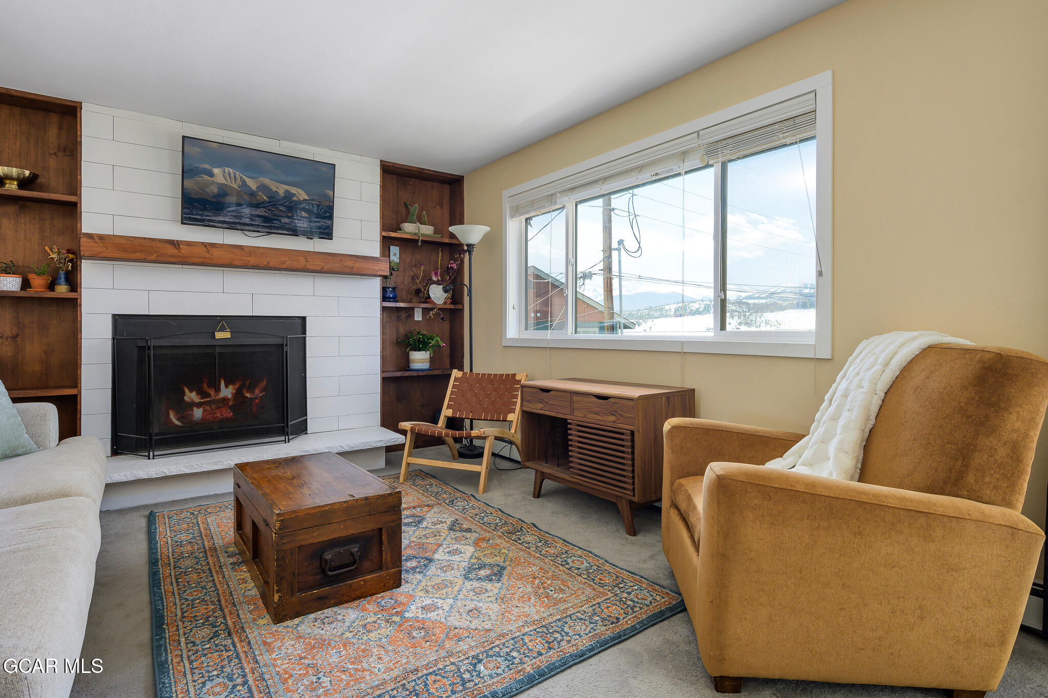 110 Carriage Road, Unit 8 Fraser, CO 80442 - Photo 6 of 36 a living room with furniture rug and window