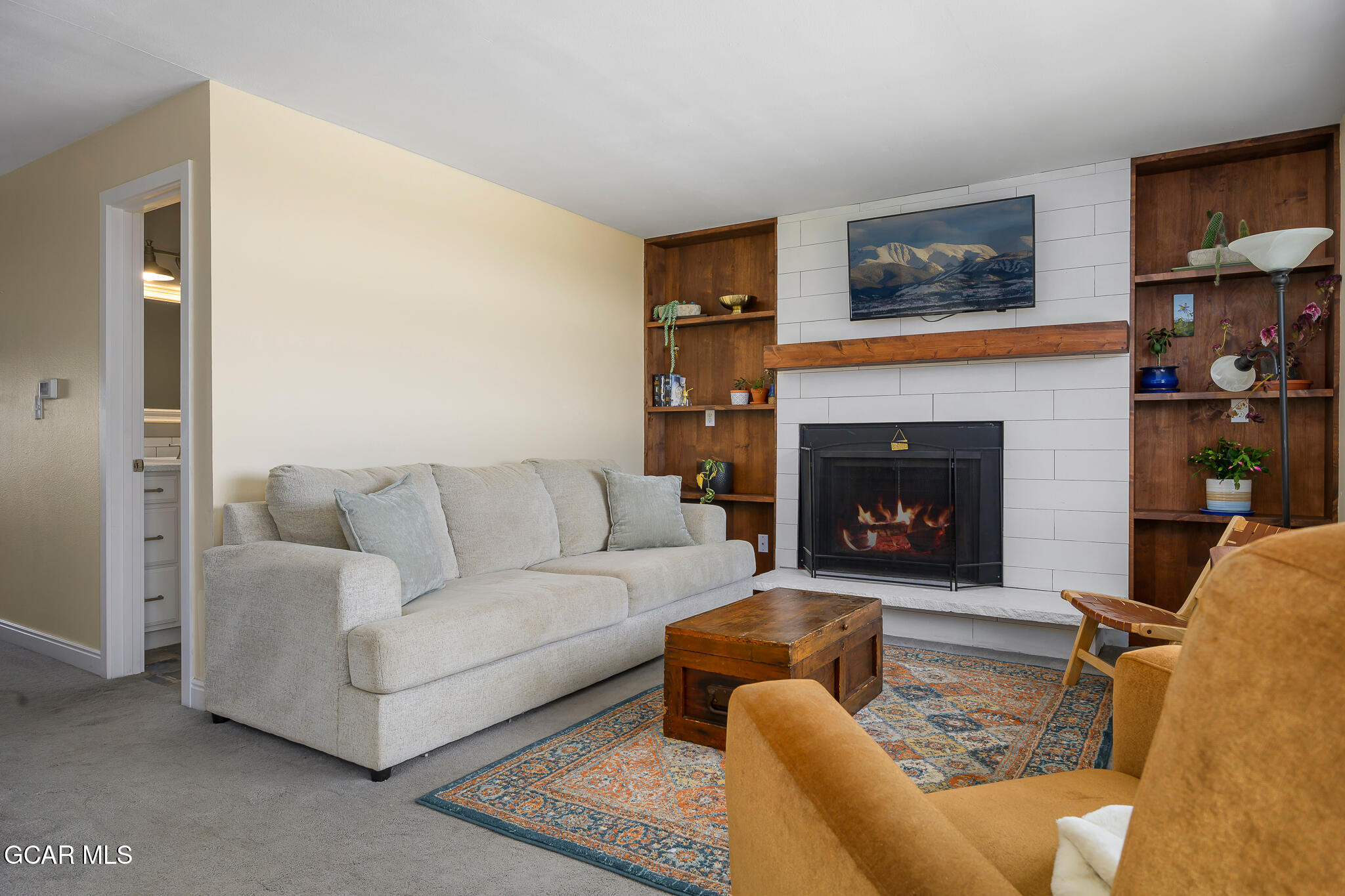 110 Carriage Road, Unit 8 Fraser, CO 80442 - Photo 9 of 36 a living room with furniture and a fireplace