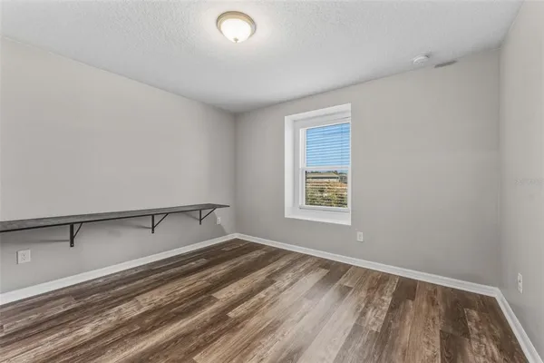 a room with a bed and a window