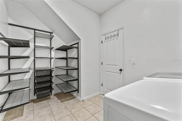 a bedroom with a bed and cabinets