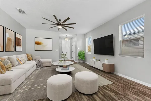 a living room with furniture and a flat screen tv
