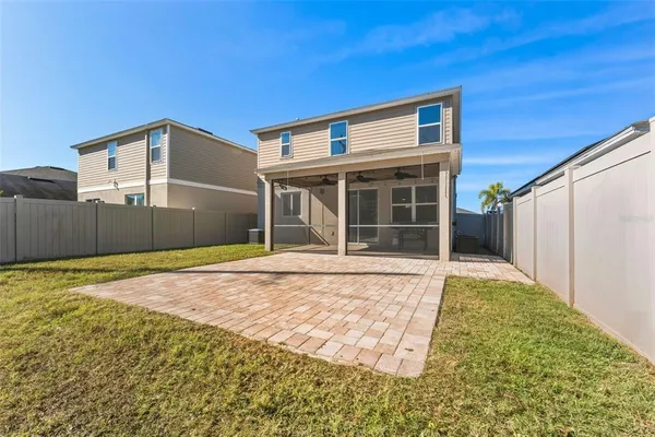 a view of a house with a backyard