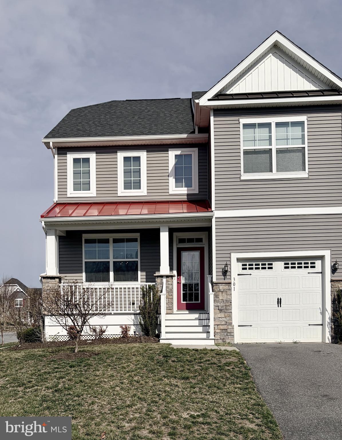 301 Arch Street Milton, DE 19968 - Photo 1 of 34 a front view of a house with garden