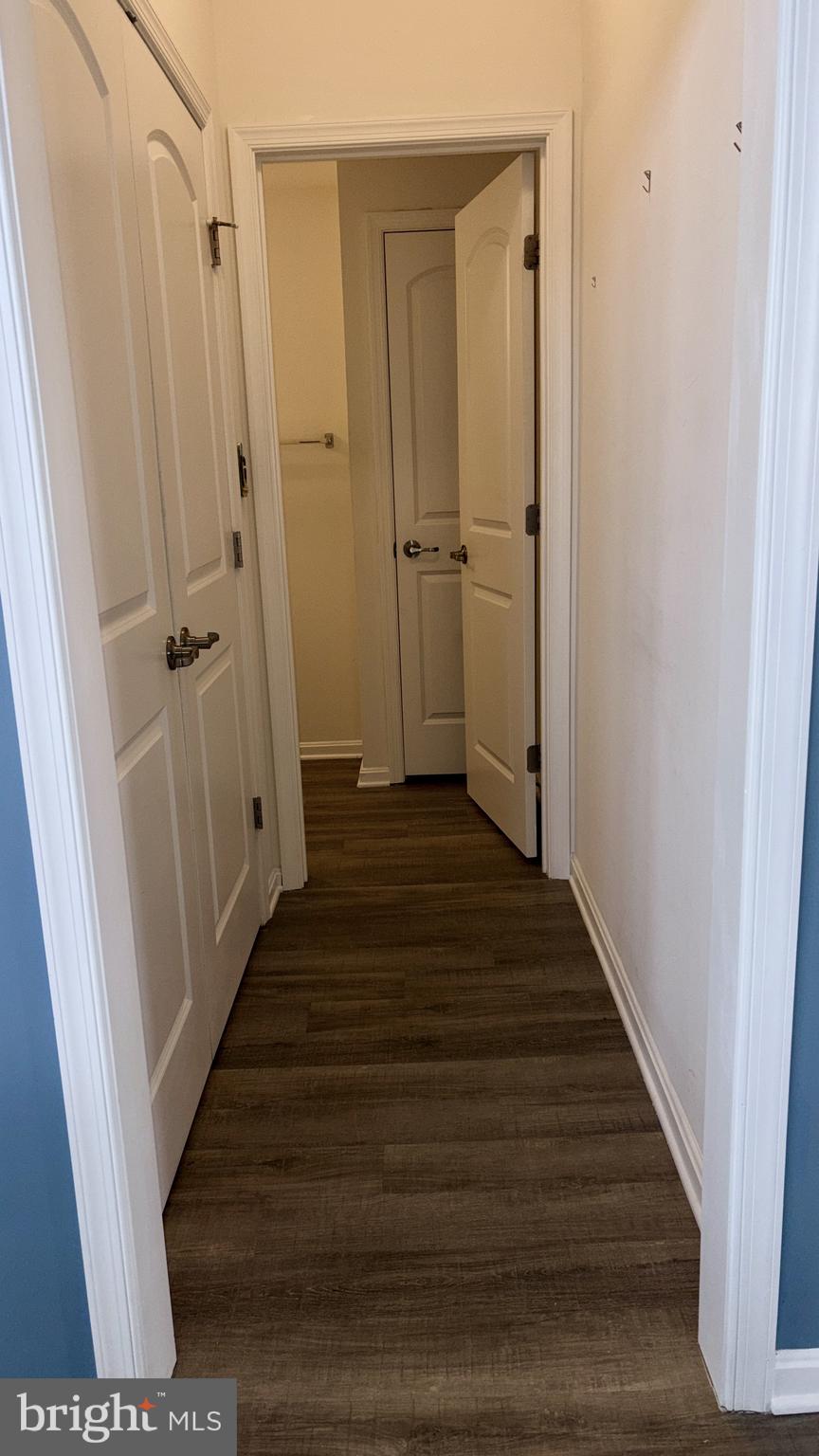 301 Arch Street Milton, DE 19968 - Photo 16 of 34 a view of a hallway with wooden floor and staircase