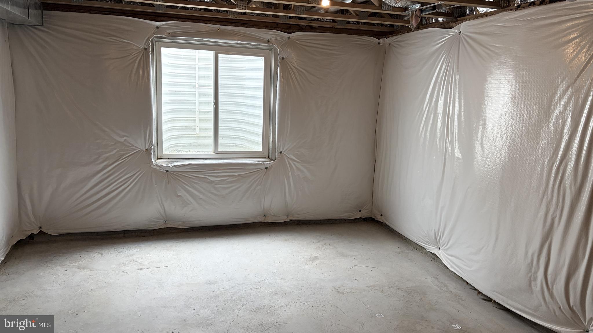 301 Arch Street Milton, DE 19968 - Photo 27 of 34 a view of an empty room with a window