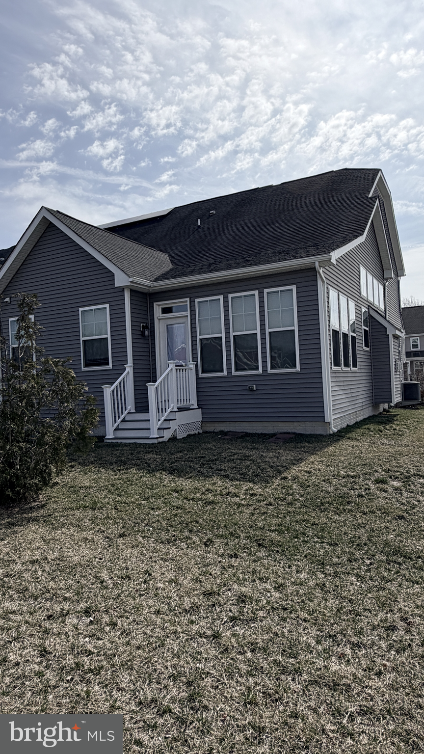 301 Arch Street Milton, DE 19968 - Photo 30 of 34 a house view with a garden space