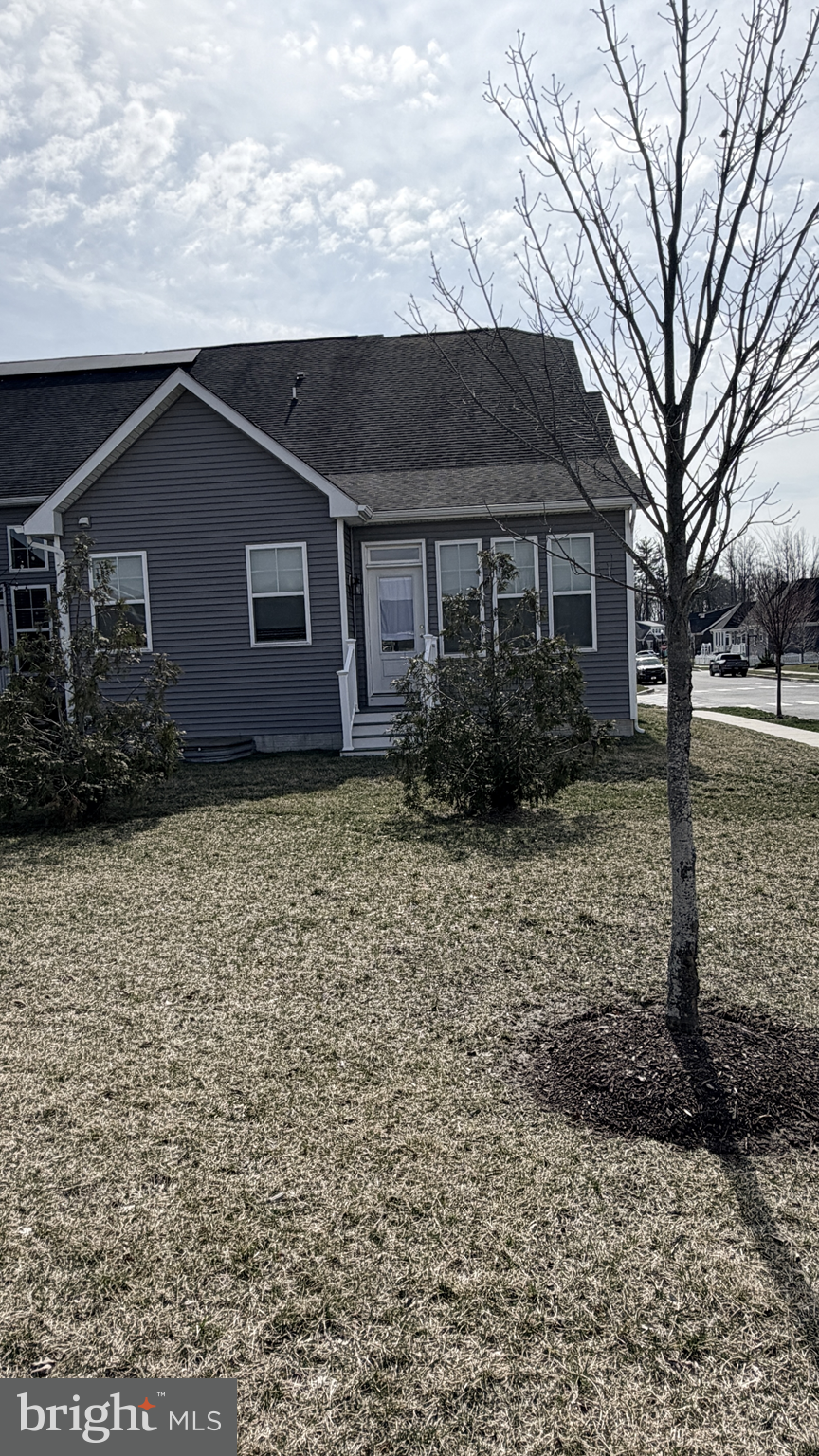 301 Arch Street Milton, DE 19968 - Photo 31 of 34 a backyard of a house with lots of green space