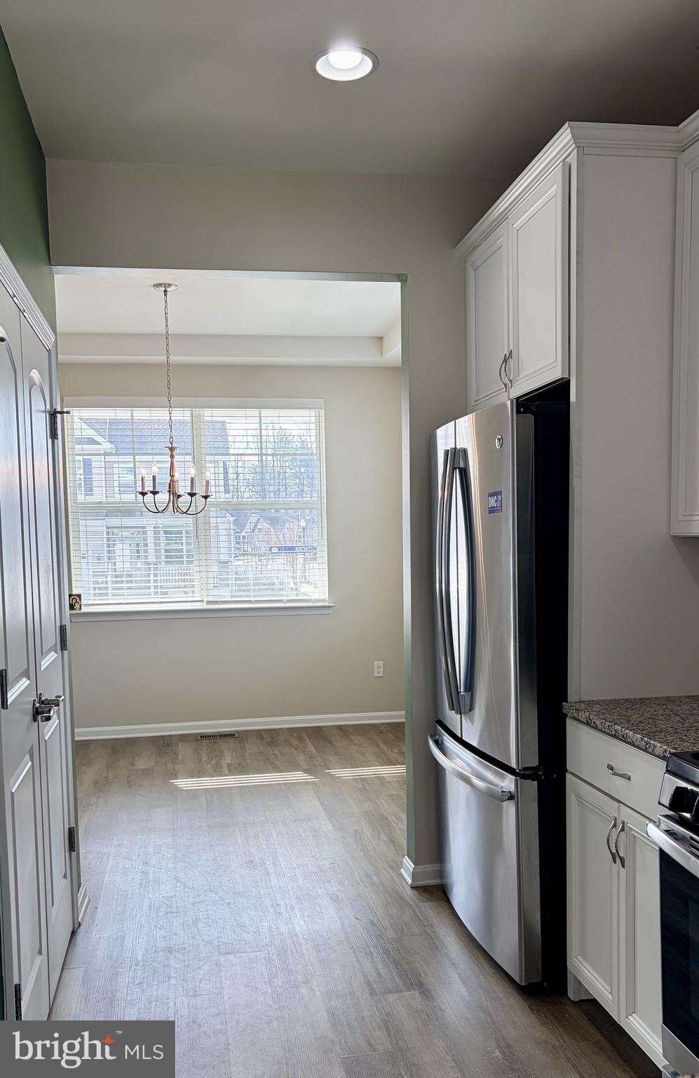301 Arch Street Milton, DE 19968 - Photo 7 of 34 a kitchen with stainless steel appliances a refrigerator and a window
