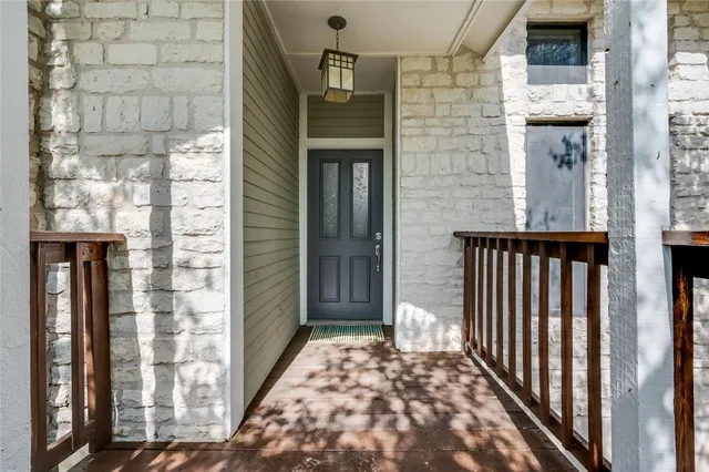 a view of a balcony with a door
