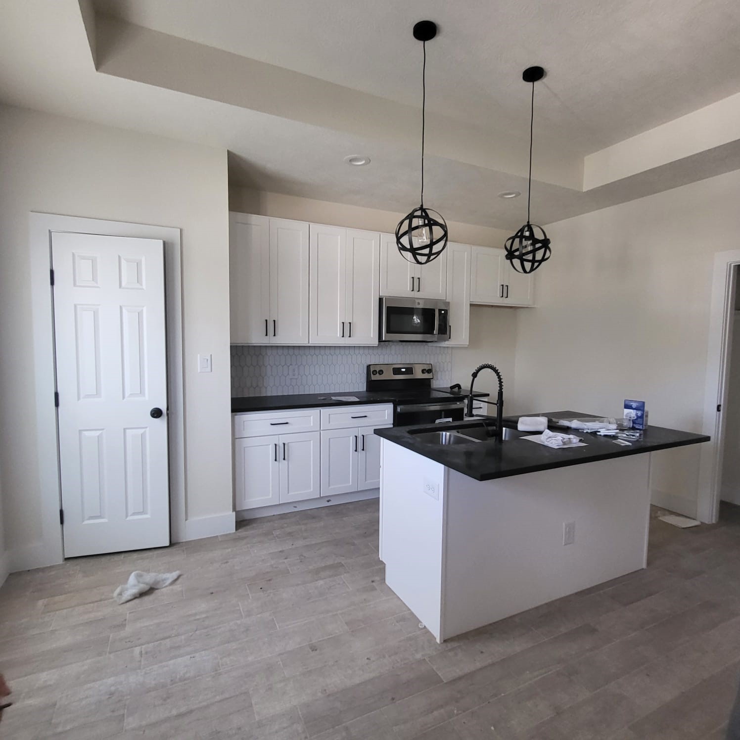 5608 Tommye Street, Unit B Houston, TX 77028 - Photo 3 of 10 a kitchen with stainless steel appliances granite countertop a sink a stove and cabinets