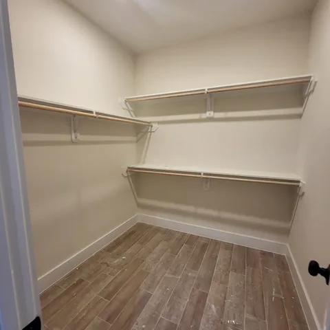 a view of an empty walk in closet