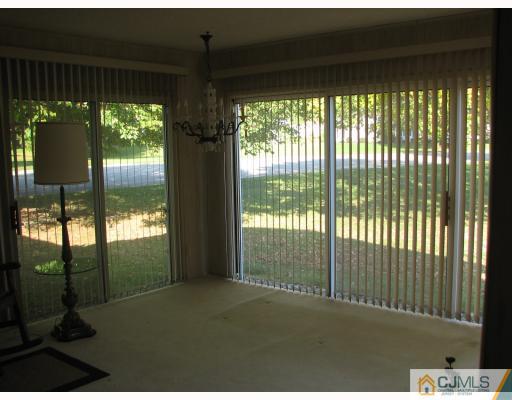 300 A Flanders Road Monroe Township, NJ 08831 - Photo 8 of 10 a floor to ceiling window in an outdoor space