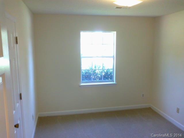 21141 Pine Ridge Drive Cornelius, NC 28031 - Photo 12 of 15 an empty room with a window
