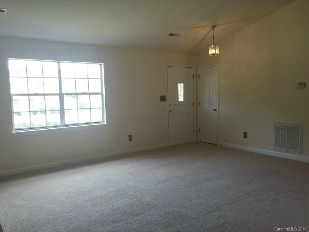 21141 Pine Ridge Drive Cornelius, NC 28031 - Photo 4 of 15 an empty room with windows