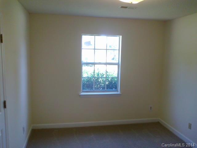 21141 Pine Ridge Drive Cornelius, NC 28031 - Photo 9 of 15 an empty room with a window