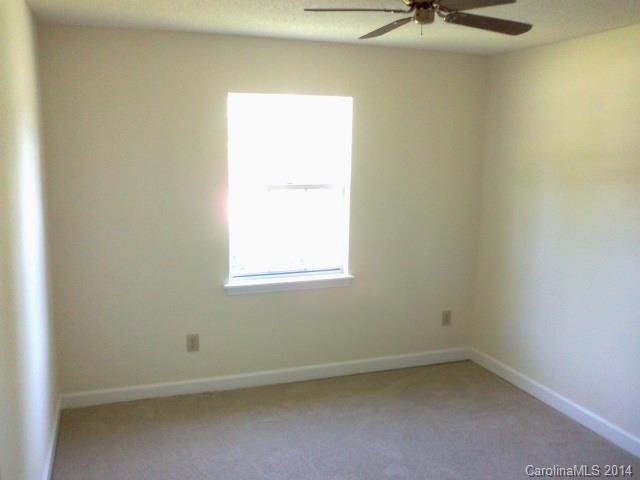 21141 Pine Ridge Drive Cornelius, NC 28031 - Photo 10 of 15 an empty room with a window