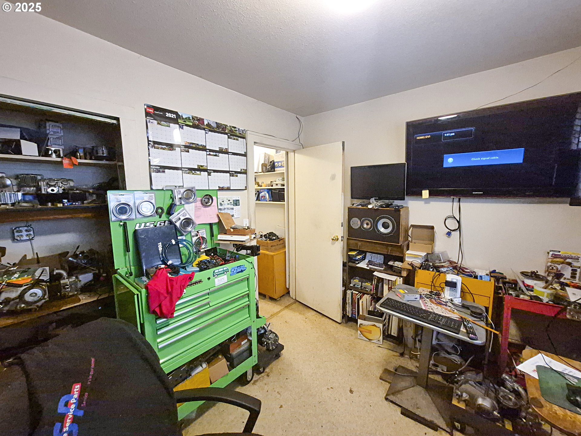 617 G Street Springfield, OR 97477 - Photo 11 of 26 a room with furniture and a flat screen tv