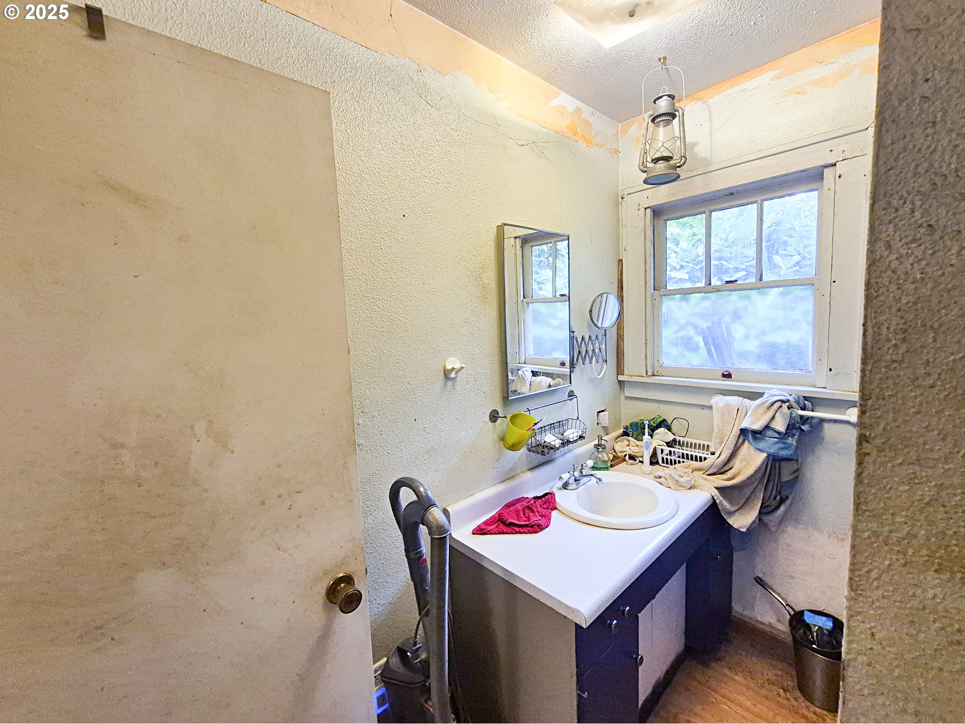 617 G Street Springfield, OR 97477 - Photo 16 of 26 a bathroom with a sink vanity granite and a mirror