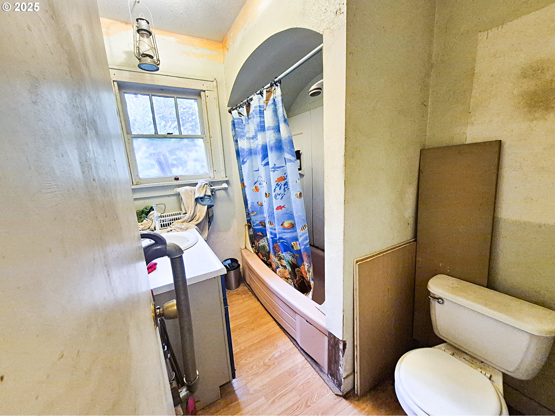617 G Street Springfield, OR 97477 - Photo 17 of 26 a bathroom with a toilet sink and mirror