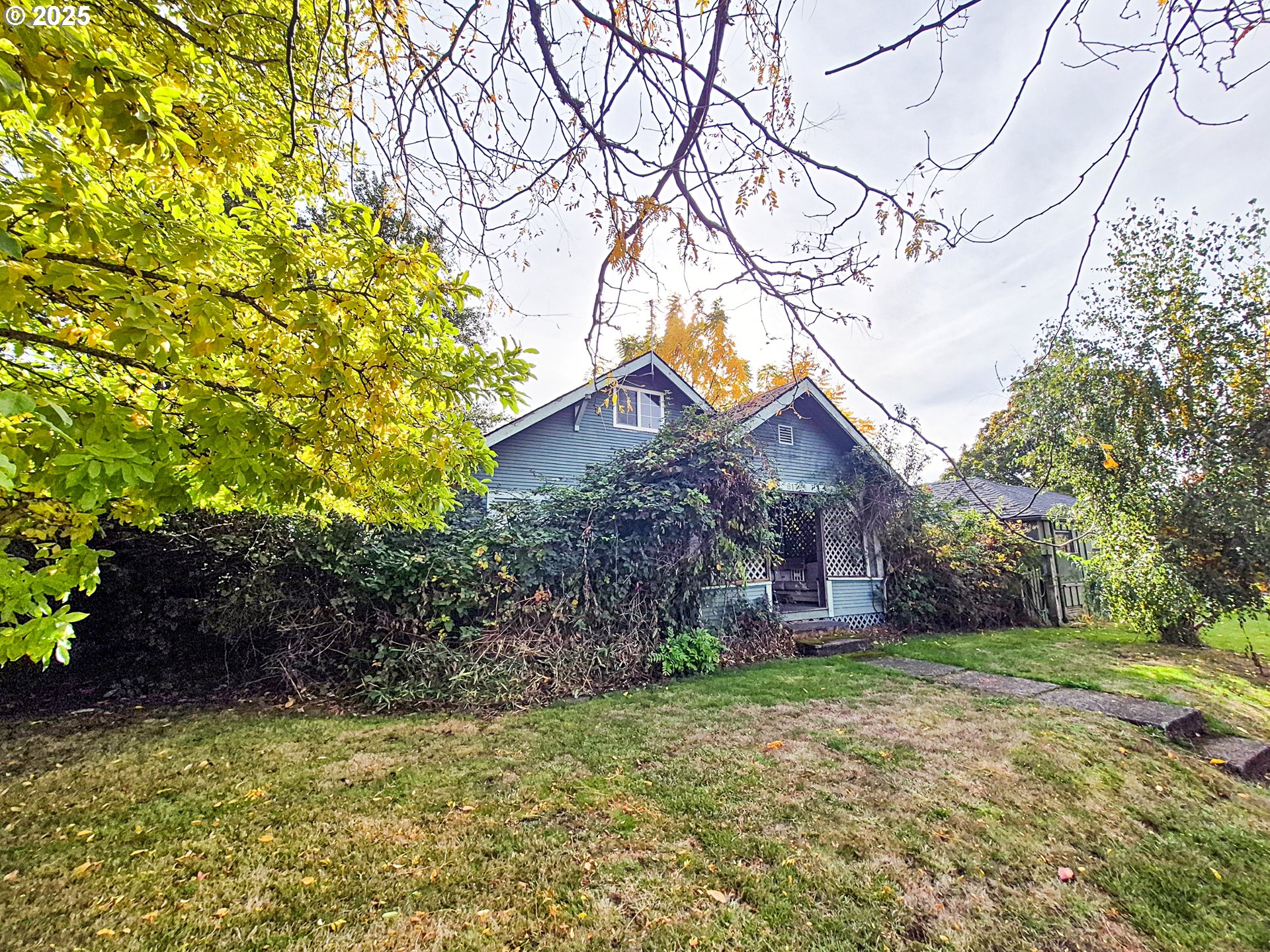 617 G Street Springfield, OR 97477 - Photo 2 of 26 a backyard of a house with lots of green space