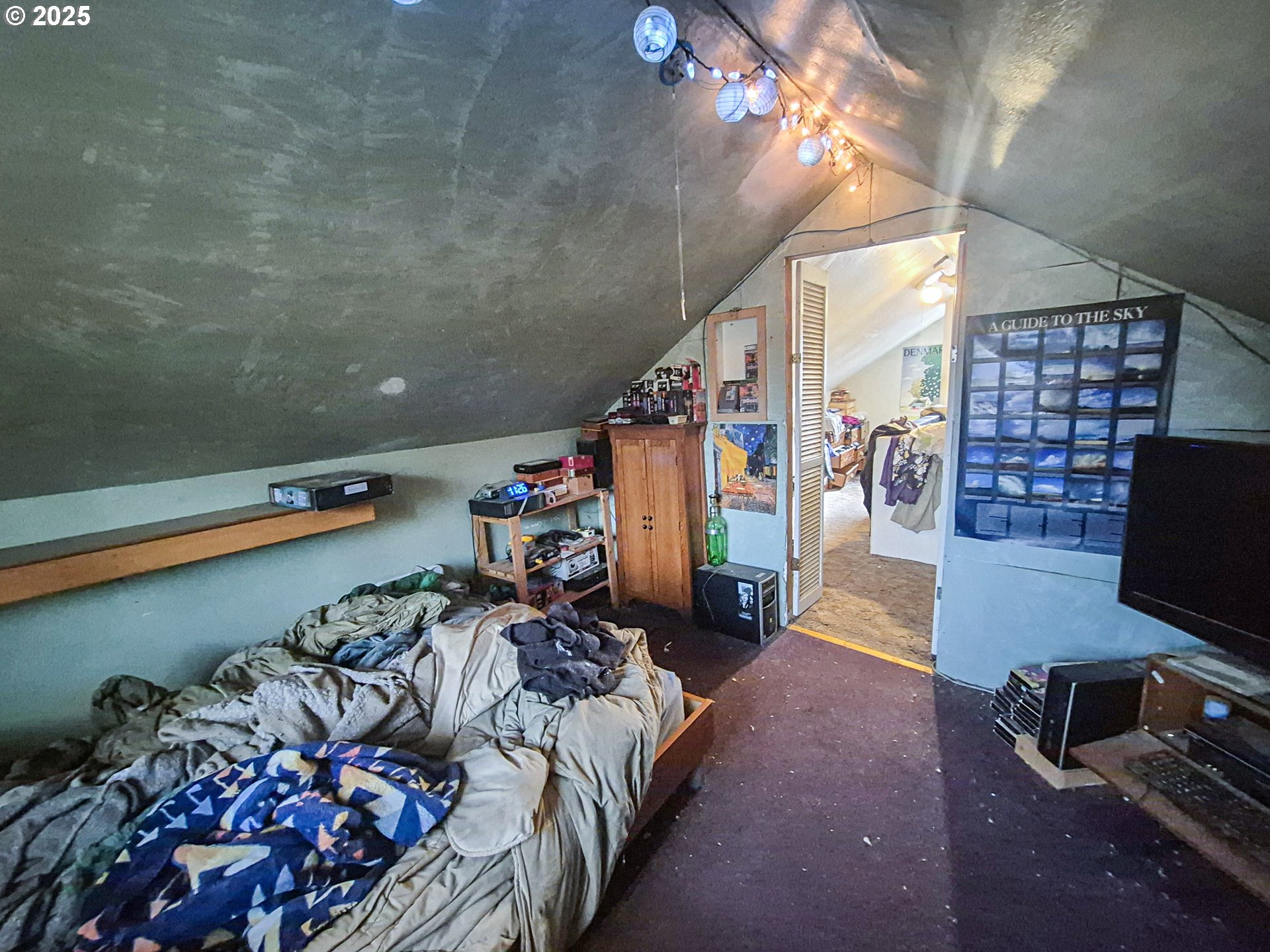 617 G Street Springfield, OR 97477 - Photo 21 of 26 a bedroom with furniture and a flat screen tv