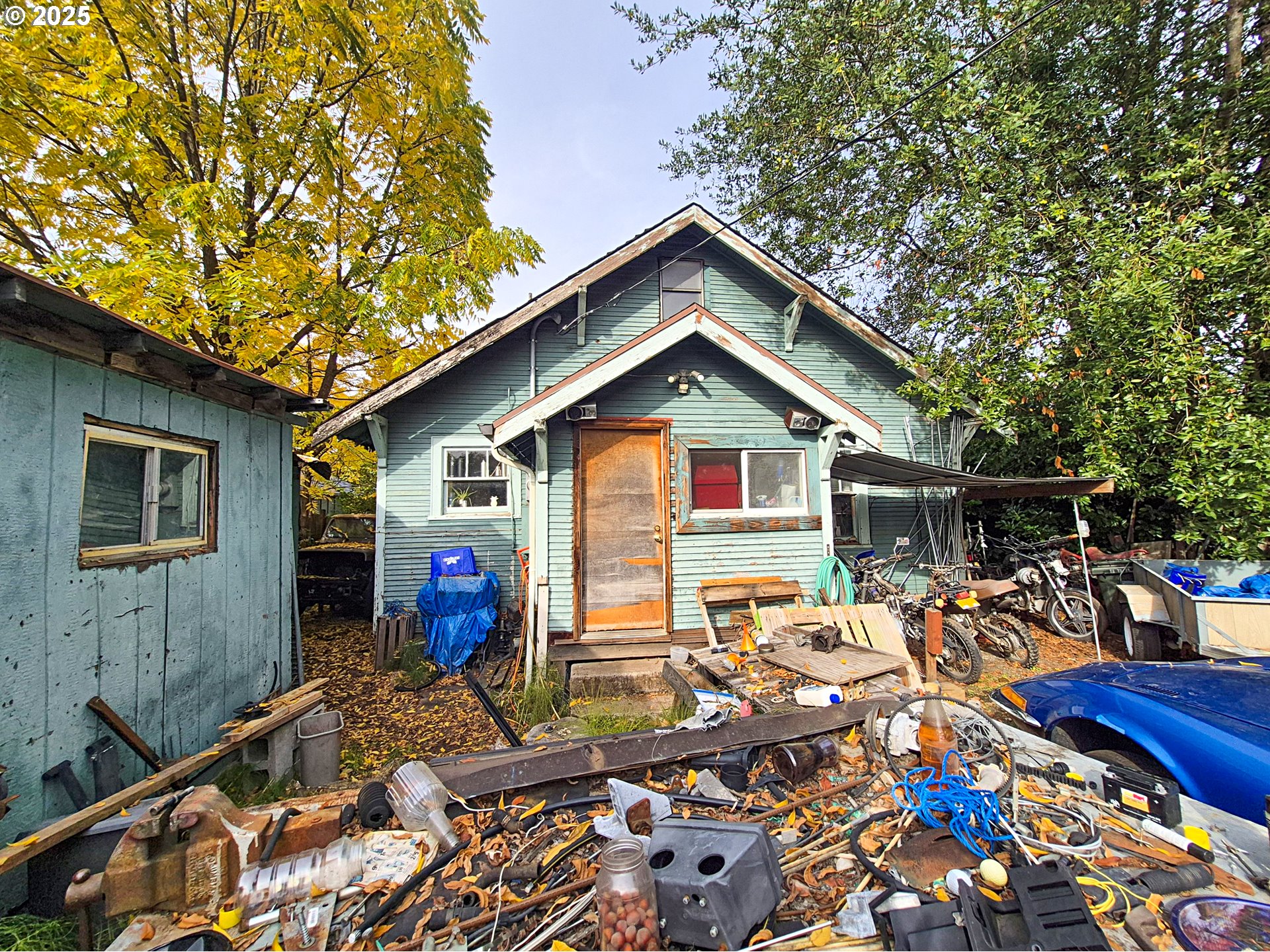 617 G Street Springfield, OR 97477 - Photo 23 of 26 a front view of house with yard outdoor seating and green space