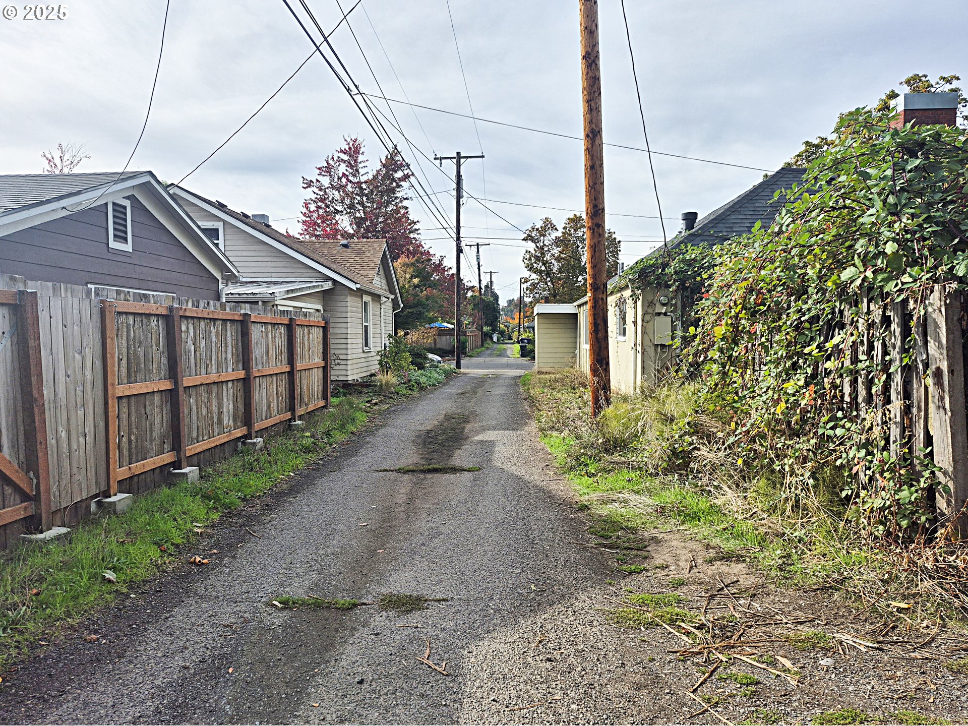 617 G Street Springfield, OR 97477 - Photo 26 of 26 a view of a house with a small yard and wooden fence