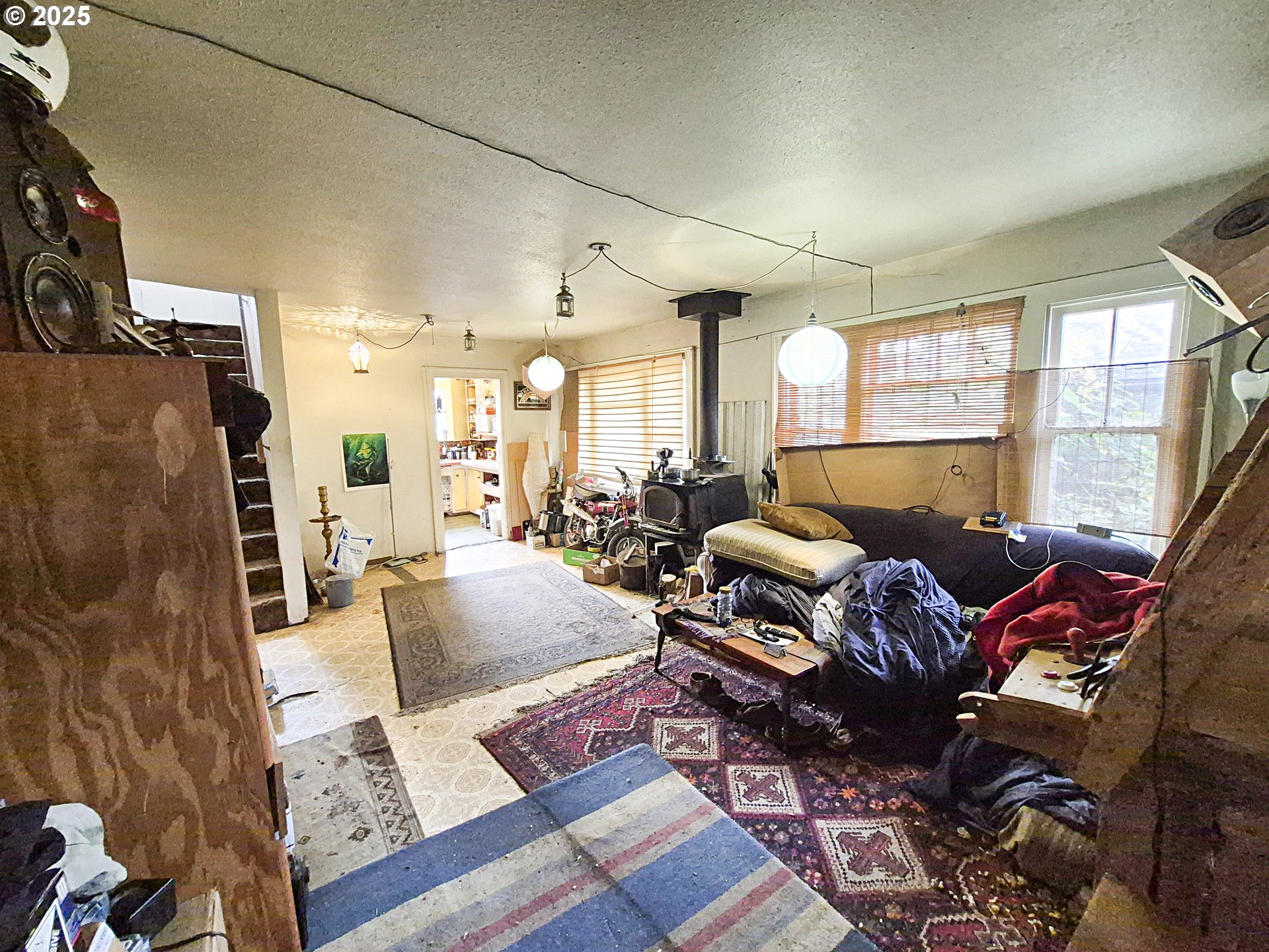 617 G Street Springfield, OR 97477 - Photo 5 of 26 a living room with furniture fireplace and a large window