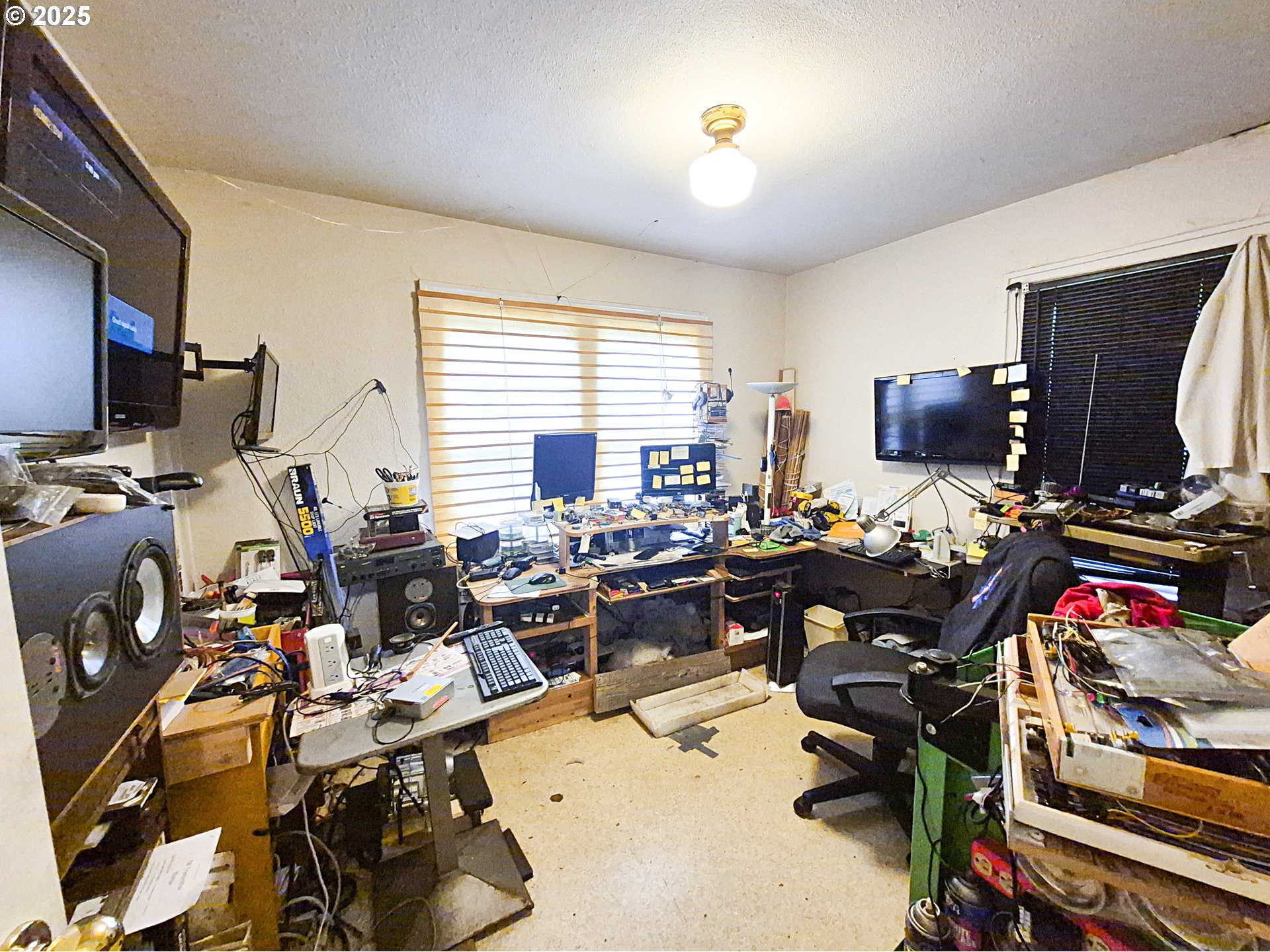 617 G Street Springfield, OR 97477 - Photo 10 of 26 a view of a workspace with furniture and a window