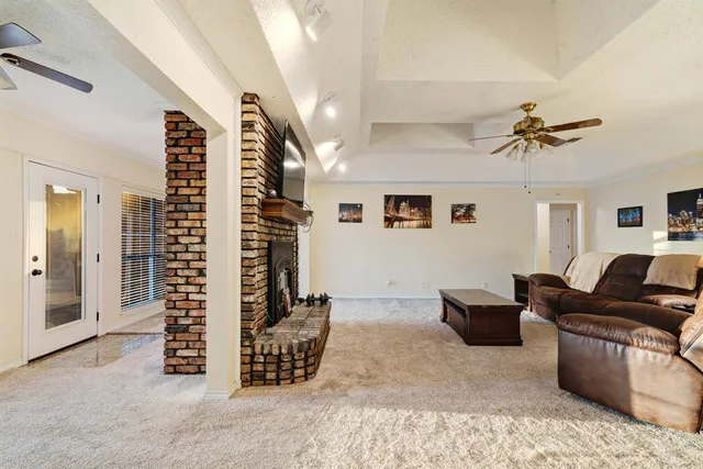 a spacious bedroom with a bed and a window