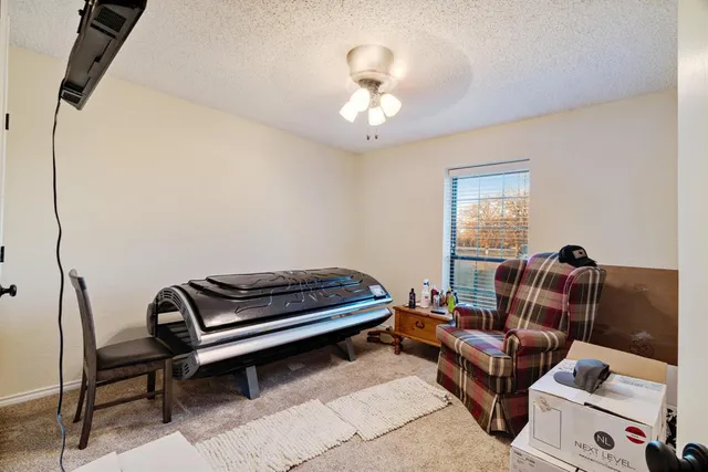 a view of a livingroom with furniture and front door